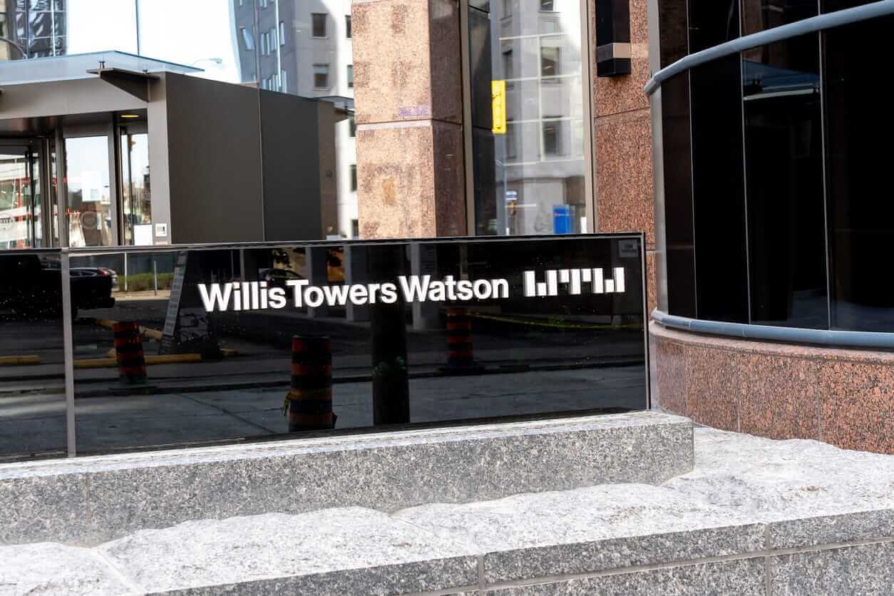 Willis Towers Watson Public Limited Co office sign-by JHVEPhoto via iStock
